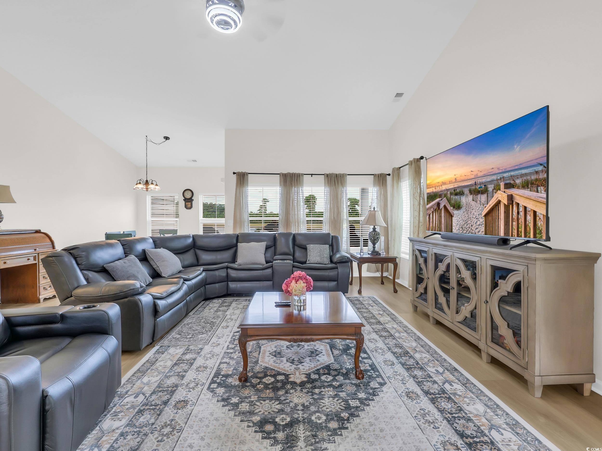 322 Augusta Grn Way Myrtle Beach, SC 29579 - Photo 8 of 34 Living room with high vaulted ceiling