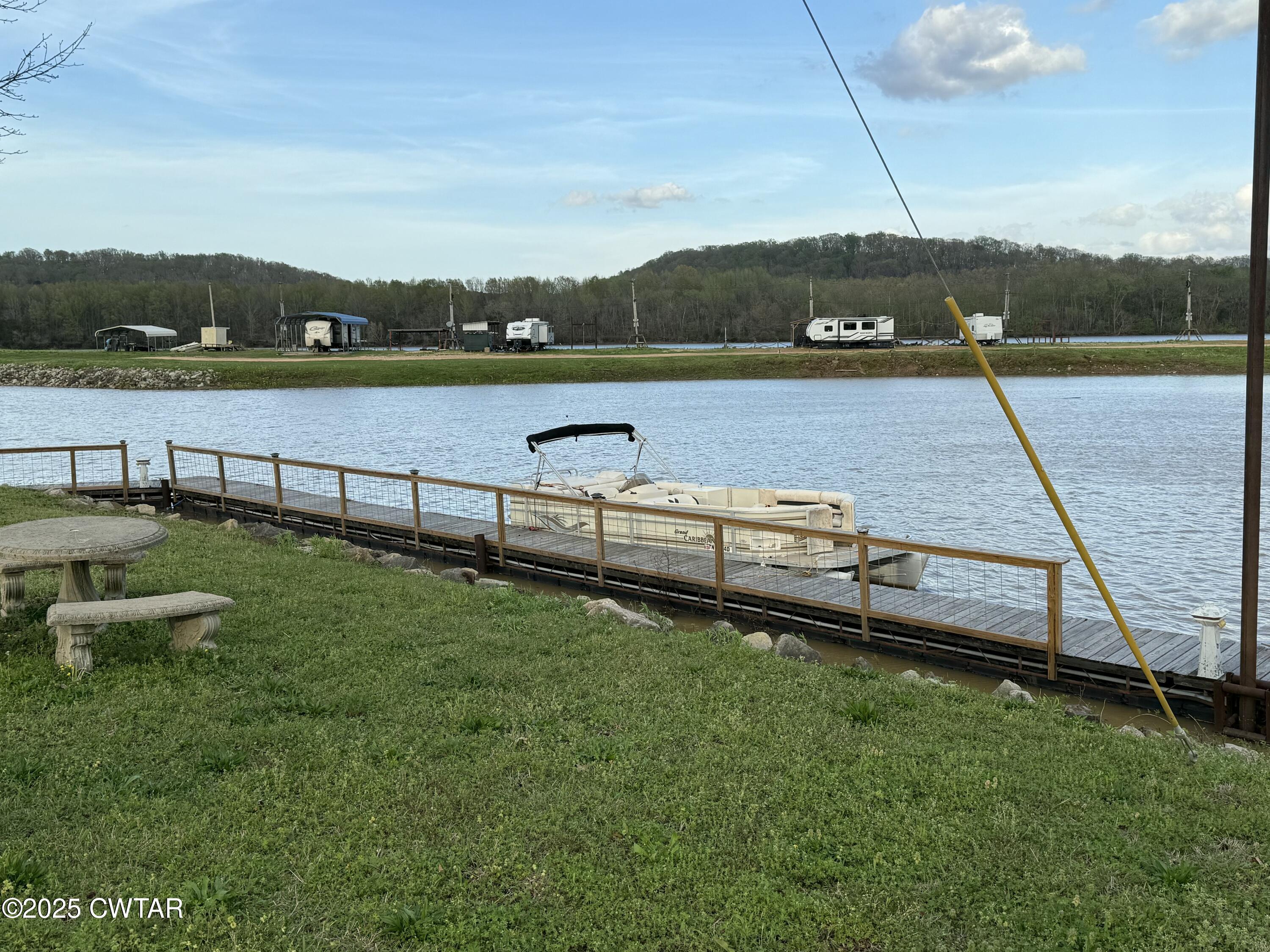 0 Yarbro Harbor Drive Decaturville, TN 38329 - Photo 11 of 16 a view of a lake with houses in the back