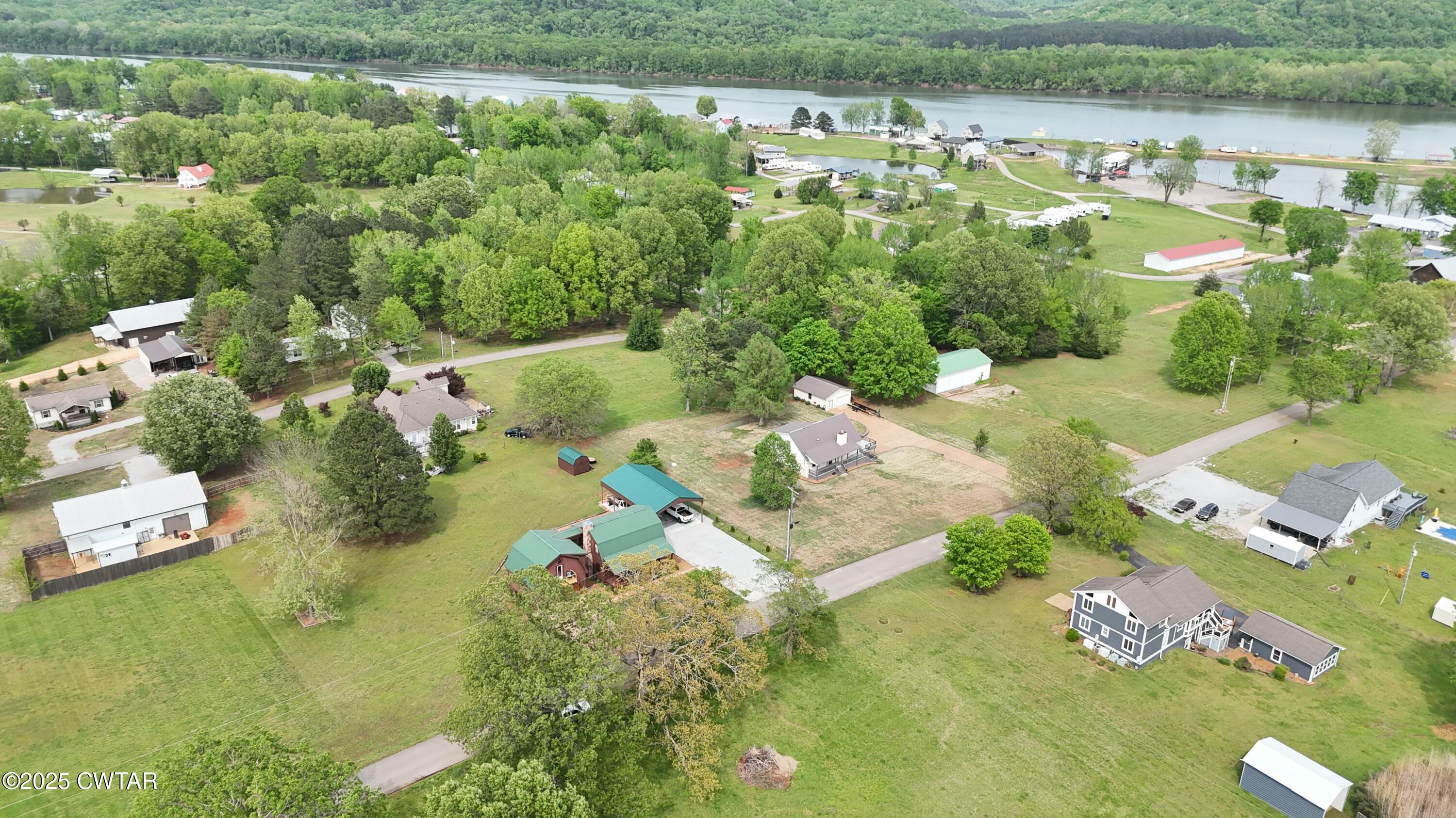 0 Yarbro Harbor Drive Decaturville, TN 38329 - Photo 14 of 16 an aerial view of a house with a yard