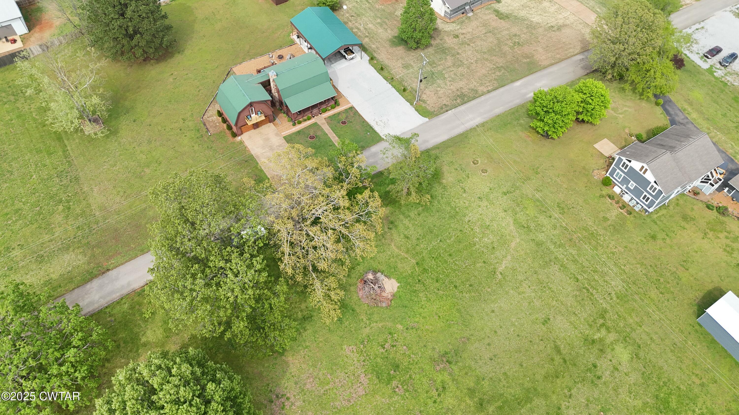 0 Yarbro Harbor Drive Decaturville, TN 38329 - Photo 16 of 16 an aerial view of a house with a yard and lake view