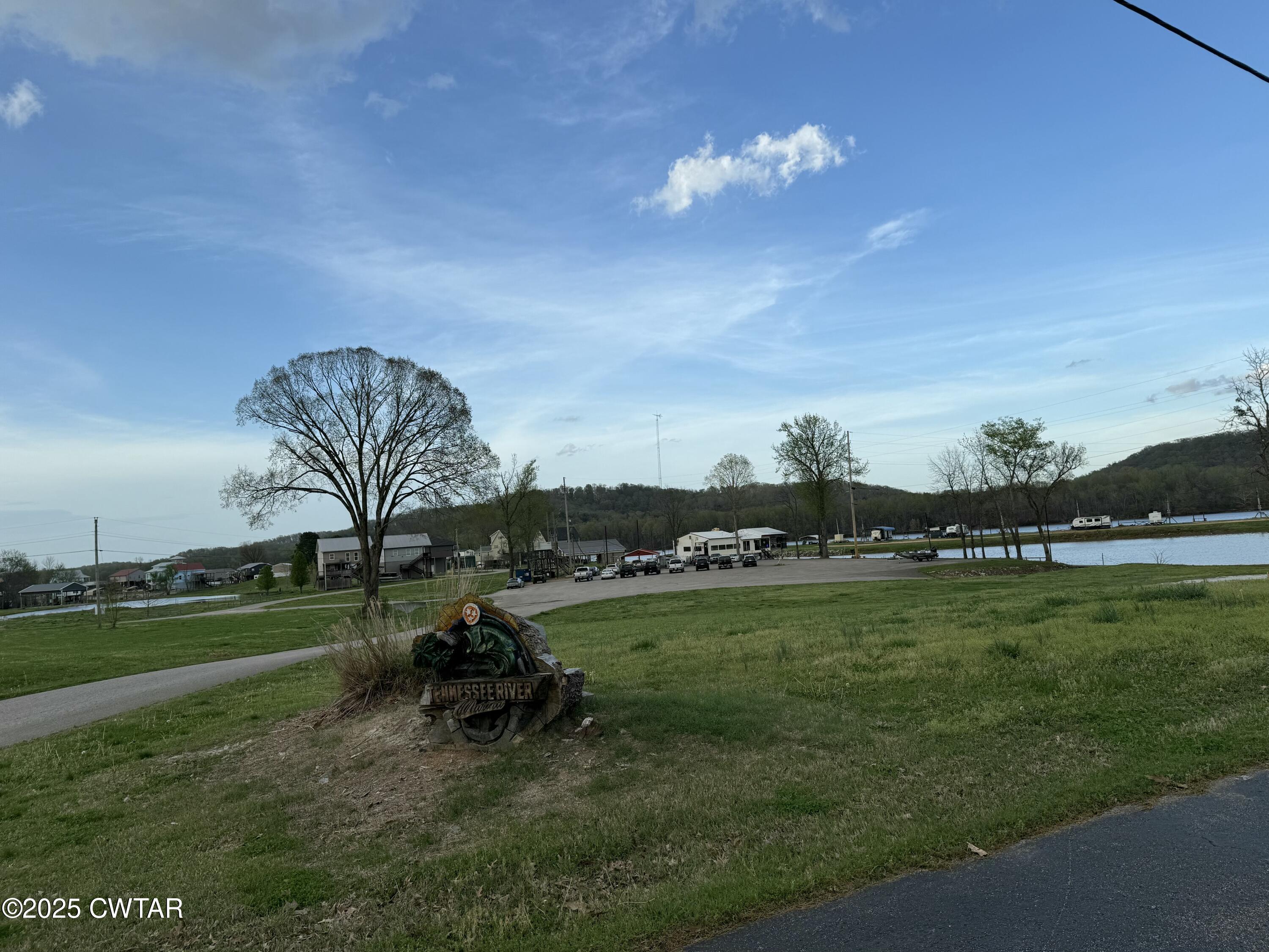 0 Yarbro Harbor Drive Decaturville, TN 38329 - Photo 8 of 16 a view of a golf course with a bench
