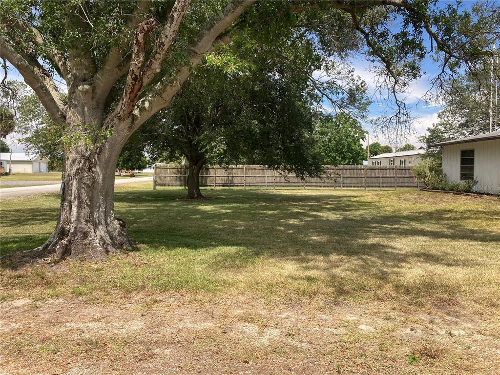1214 Alligator Road Moore Haven, FL 33471 - Photo 2 of 4 a swimming pool with an outdoor space and seating