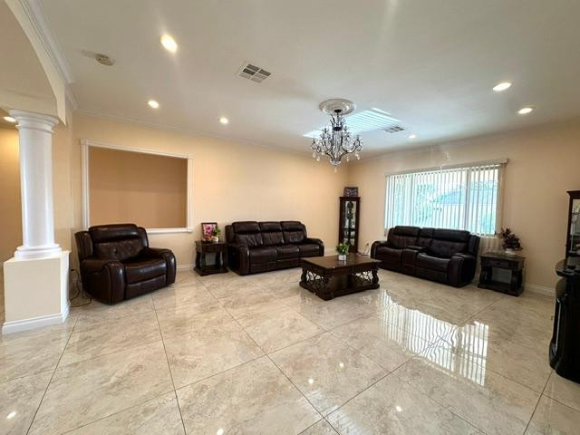 6830 North 14th Street Phoenix, AZ 85014 - Photo 3 of 28 a living room with furniture and a chandelier