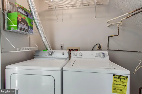 a view of a house with backyard and porch