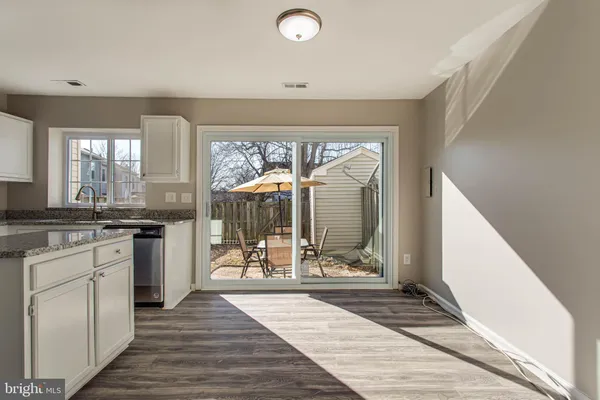 a view of a kitchen from the hallway