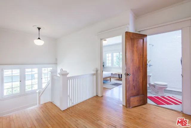a bathroom with a sink a mirror and a toilet