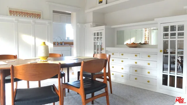 a kitchen with a refrigerator and a stove