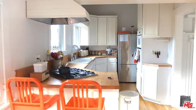 a view of an empty room and a window