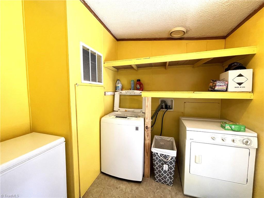 1524 Ray Wilson Road Sandy Ridge, NC 27046 - Photo 23 of 33 Laundry room washer and dryer to convey