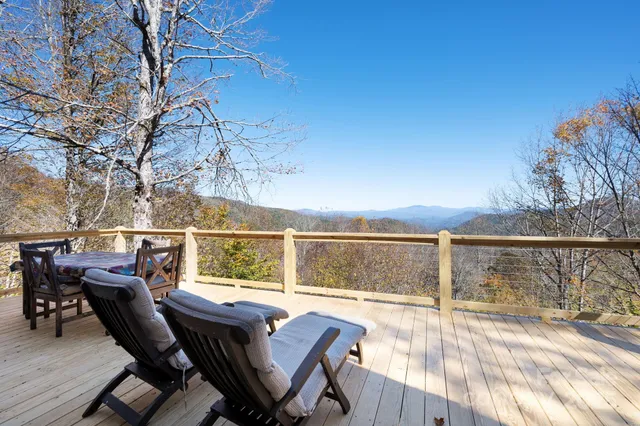 a view of a balcony with furniture