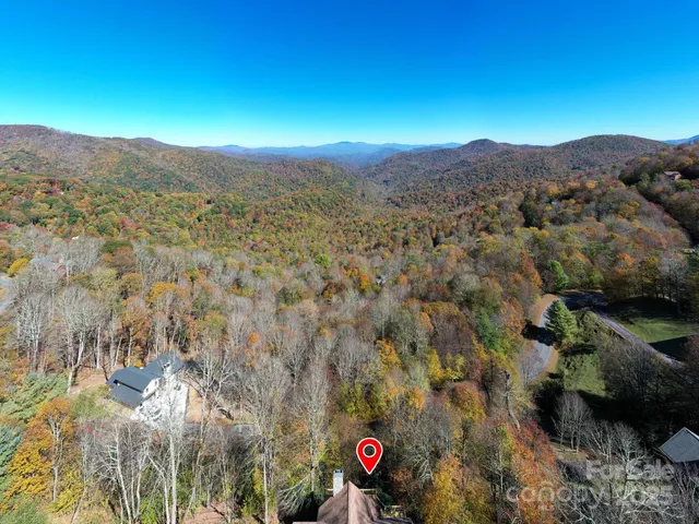a view of a street with mountains in the background