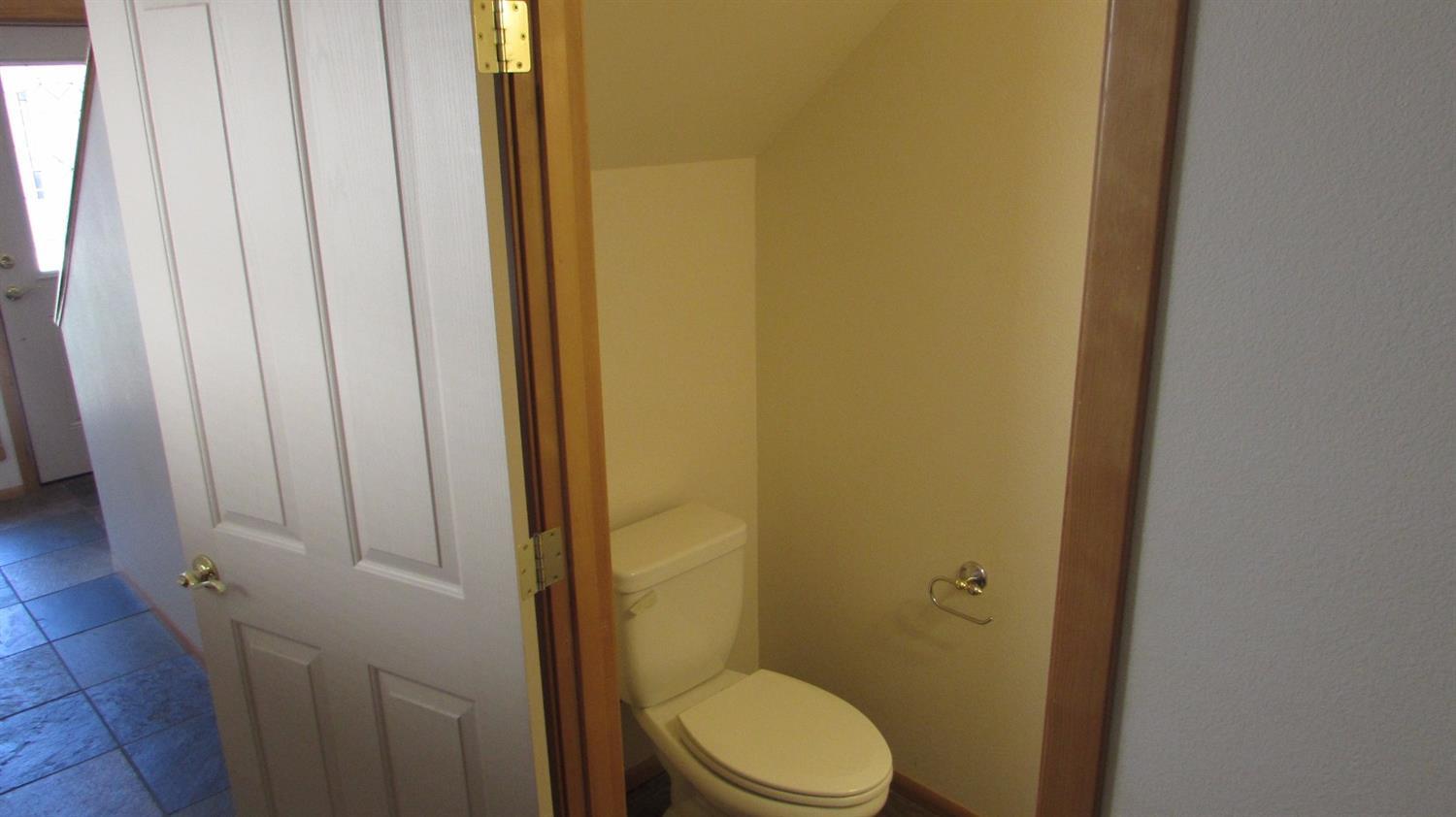 608 Shadow Way Central Point, OR 97502 - Photo 16 of 33 a bathroom with a toilet and a shower
