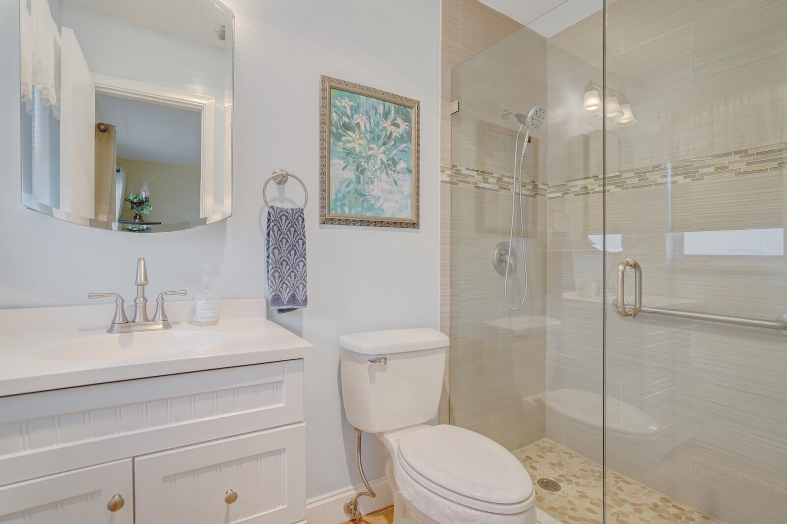 2100 Northeast 38th Street, Unit 111 Lighthouse Point, FL 33064 - Photo 15 of 25 a bathroom with a sink a toilet and shower