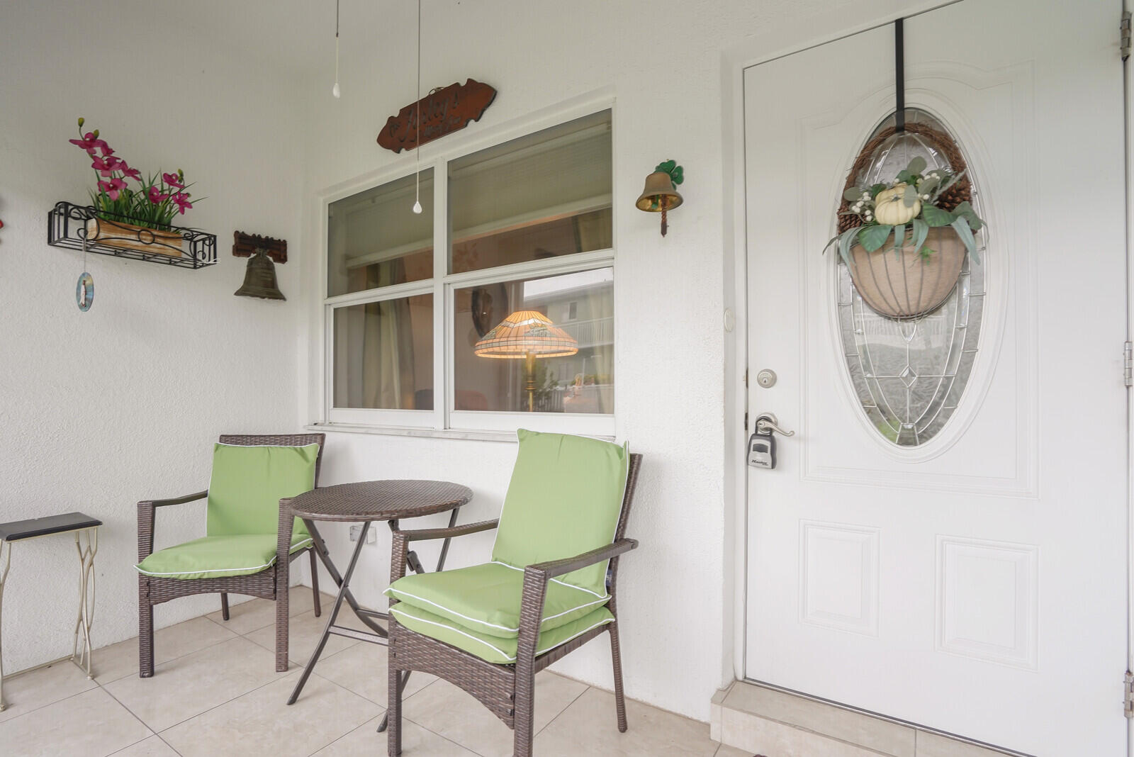2100 Northeast 38th Street, Unit 111 Lighthouse Point, FL 33064 - Photo 2 of 25 a living room with furniture and a window