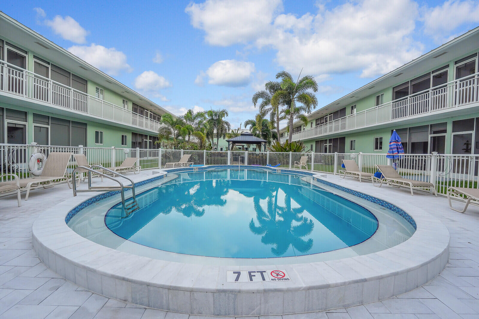 2100 Northeast 38th Street, Unit 111 Lighthouse Point, FL 33064 - Photo 21 of 25 a view of swimming pool with outdoor seating