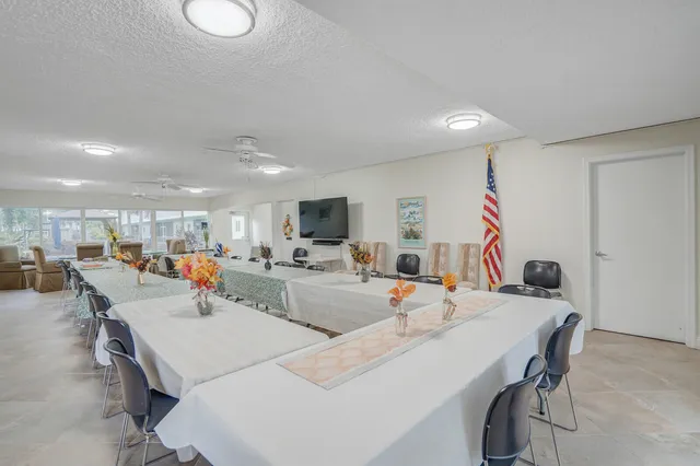 a view of a kitchen with a sink and stainless steel appliances