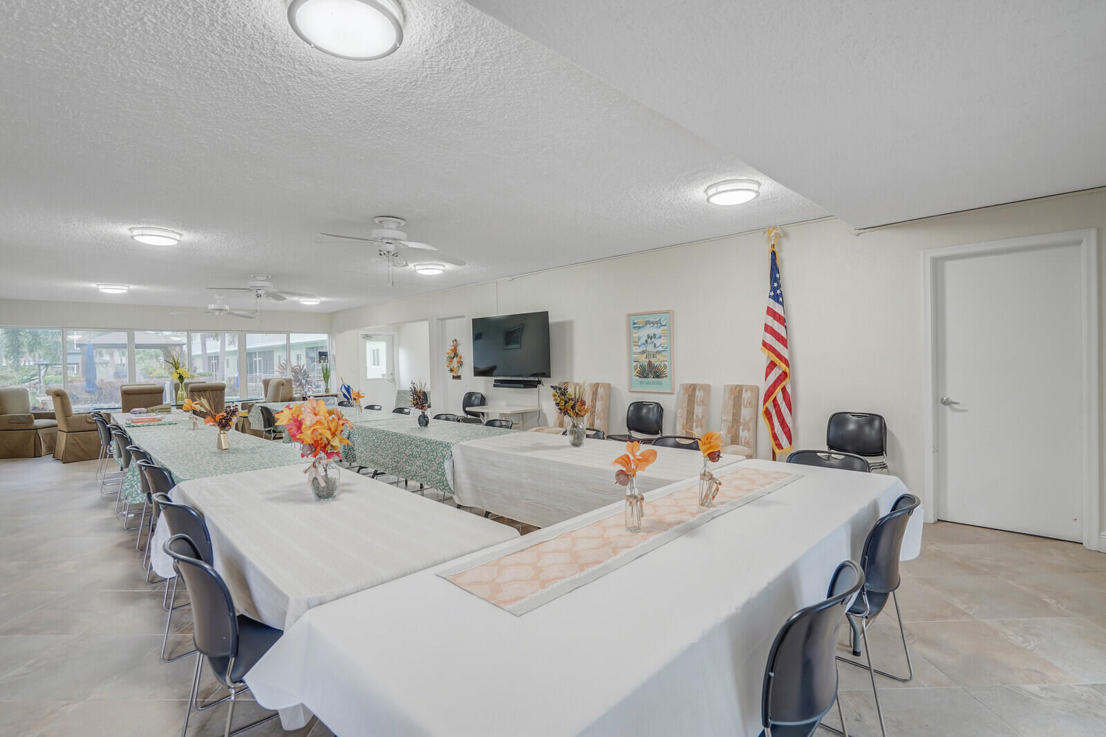 2100 Northeast 38th Street, Unit 111 Lighthouse Point, FL 33064 - Photo 23 of 25 a view of a dining hall with furniture and a large window