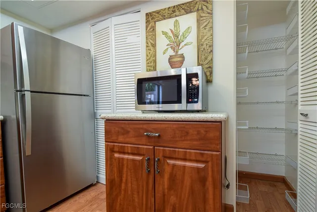 a view of gallery with wooden floor