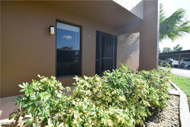 a view of a car parked in front of a house