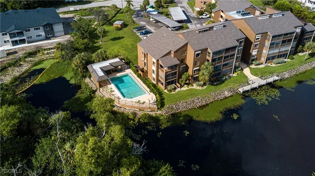 a bathroom with a granite countertop sink and shower