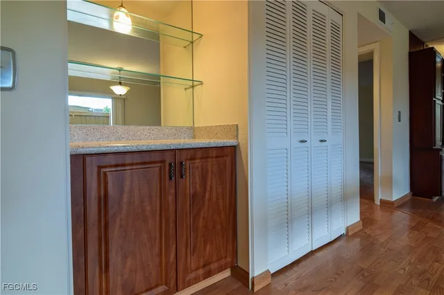 an aerial view of a house with a yard and lake view