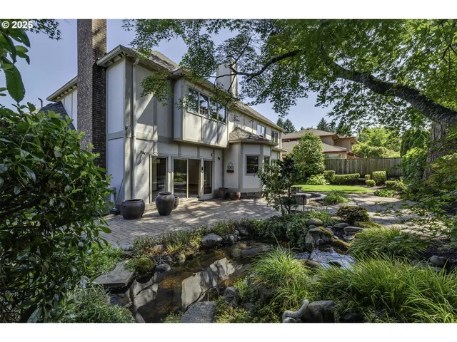 a view of a house with a small yard and plants