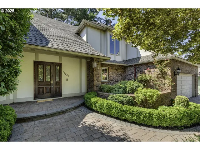 a view of a small house with a garden