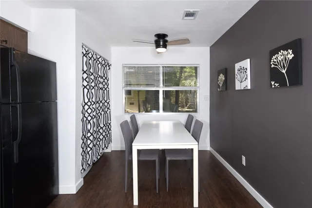 a dinning room with large window