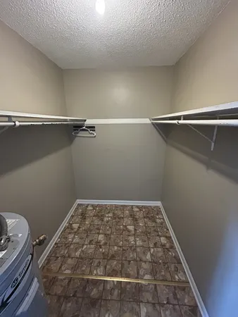 a view of a room with racks on the wall