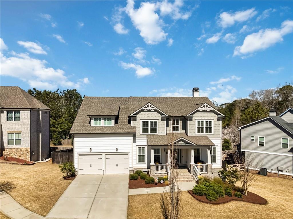 19 Tralee Way Suwanee, GA 30024 - Photo 1 of 55 a front view of a house with a view of a yard