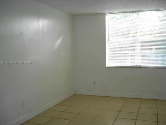 a view of a room that has a window in it