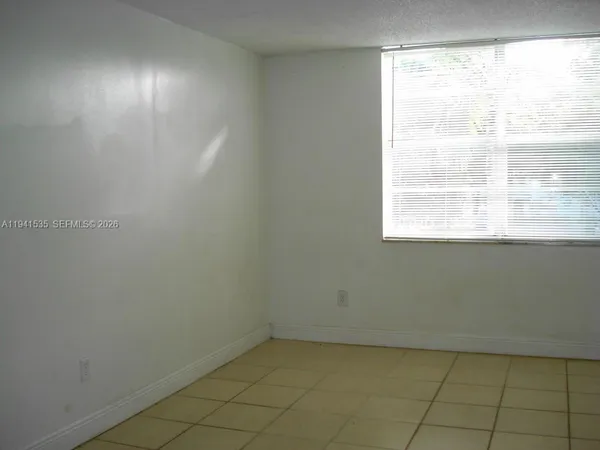 a view of a room that has a window in it