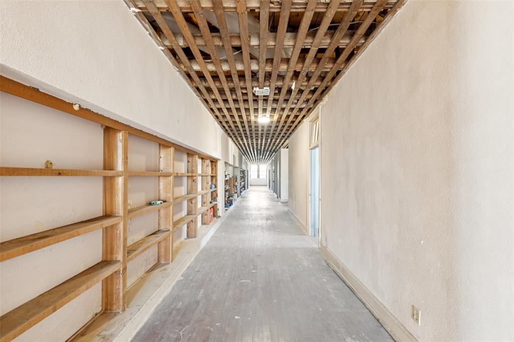 2591 Fm 1204 Decatur, TX 76234 - Photo 7 of 15 Hallway with wood finished floors and a textured wall