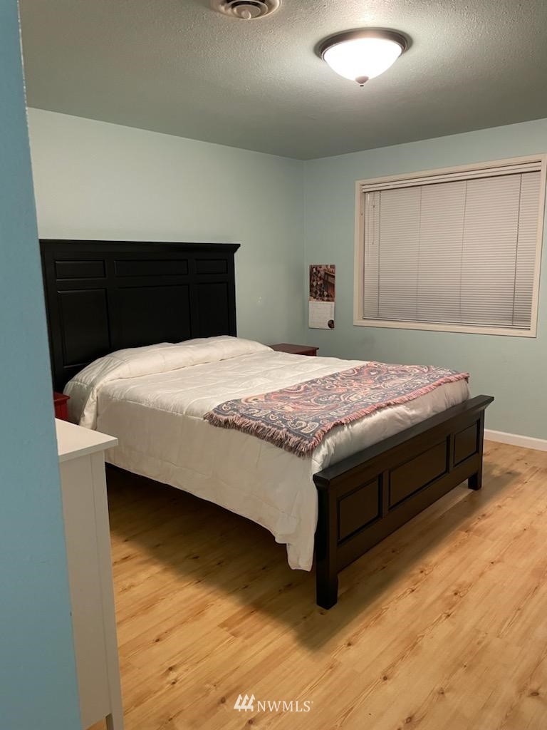 11221 180th Lane Southwest Rochester, WA 98579 - Photo 15 of 24 a bedroom with a bed and window