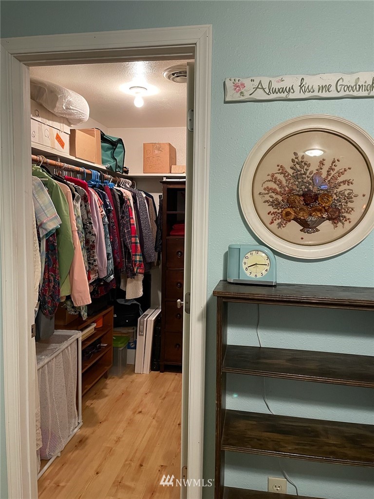 11221 180th Lane Southwest Rochester, WA 98579 - Photo 16 of 24 a view of walk in closet with clothes and shoes