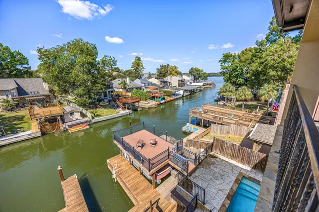 a view of a lake with outdoor seating