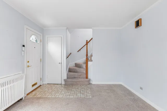 a view of an entryway with stairs
