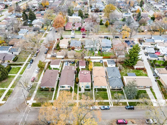 an aerial view of residential houses with outdoor space