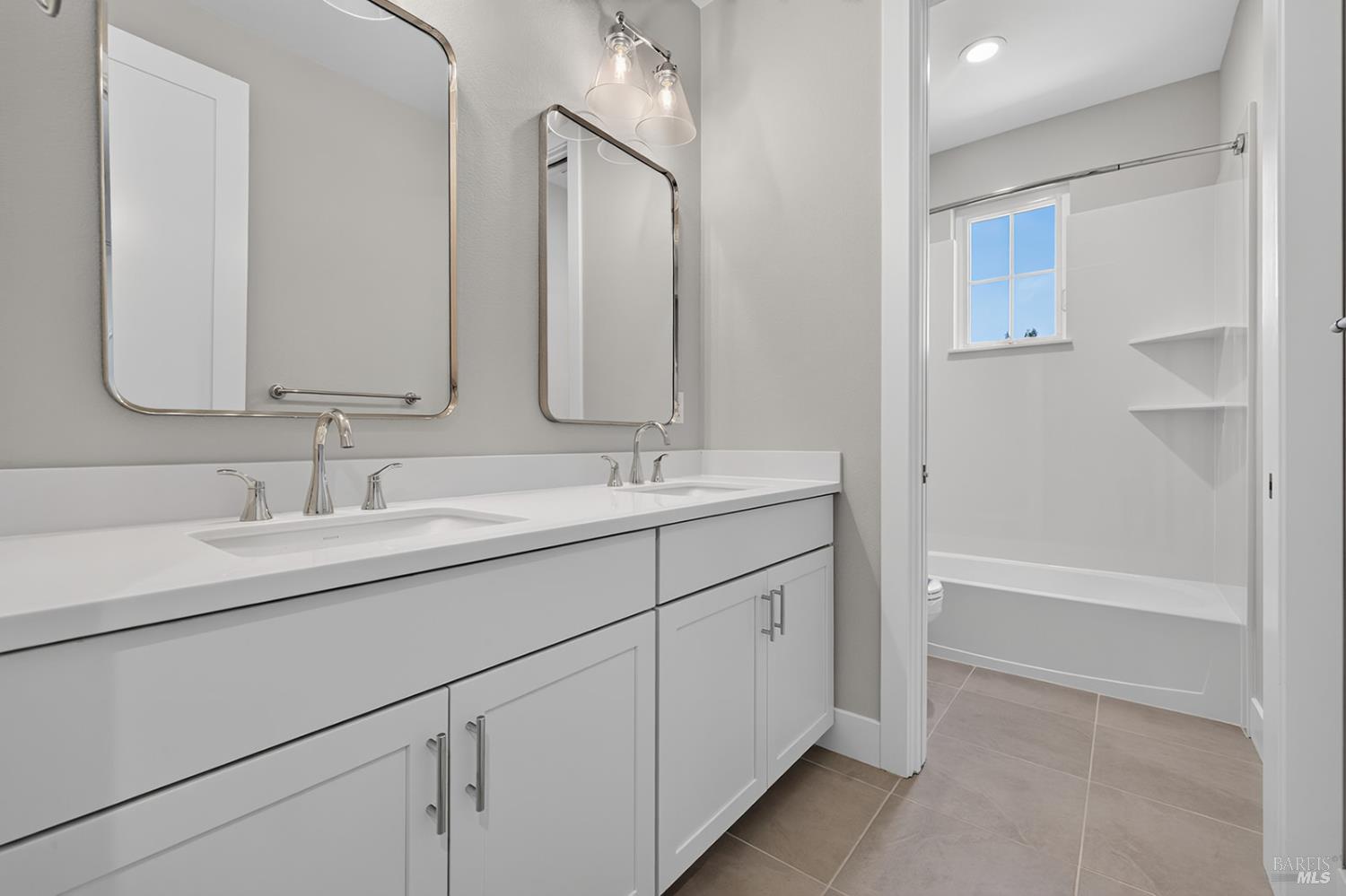 1907 Carlile Place Santa Rosa, CA 95403 - Photo 38 of 55 Here is the upper-level bathroom that is located in the hallway near the two secondary bedrooms and media / bonus room. This bathroom has a shower over tub.