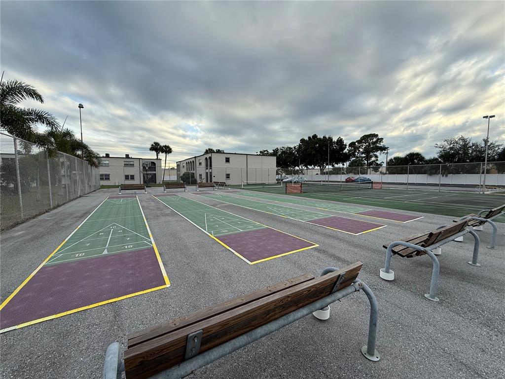7701 Starkey Road, Unit 711 Seminole, FL 33777 - Photo 14 of 21 a view of an outdoor space and tennis court