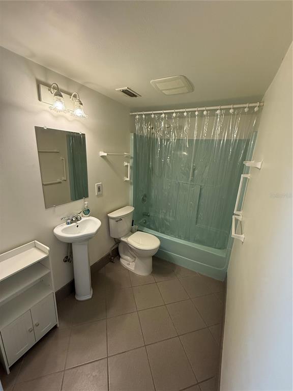 7701 Starkey Road, Unit 711 Seminole, FL 33777 - Photo 4 of 21 a bathroom with a sink toilet and shower