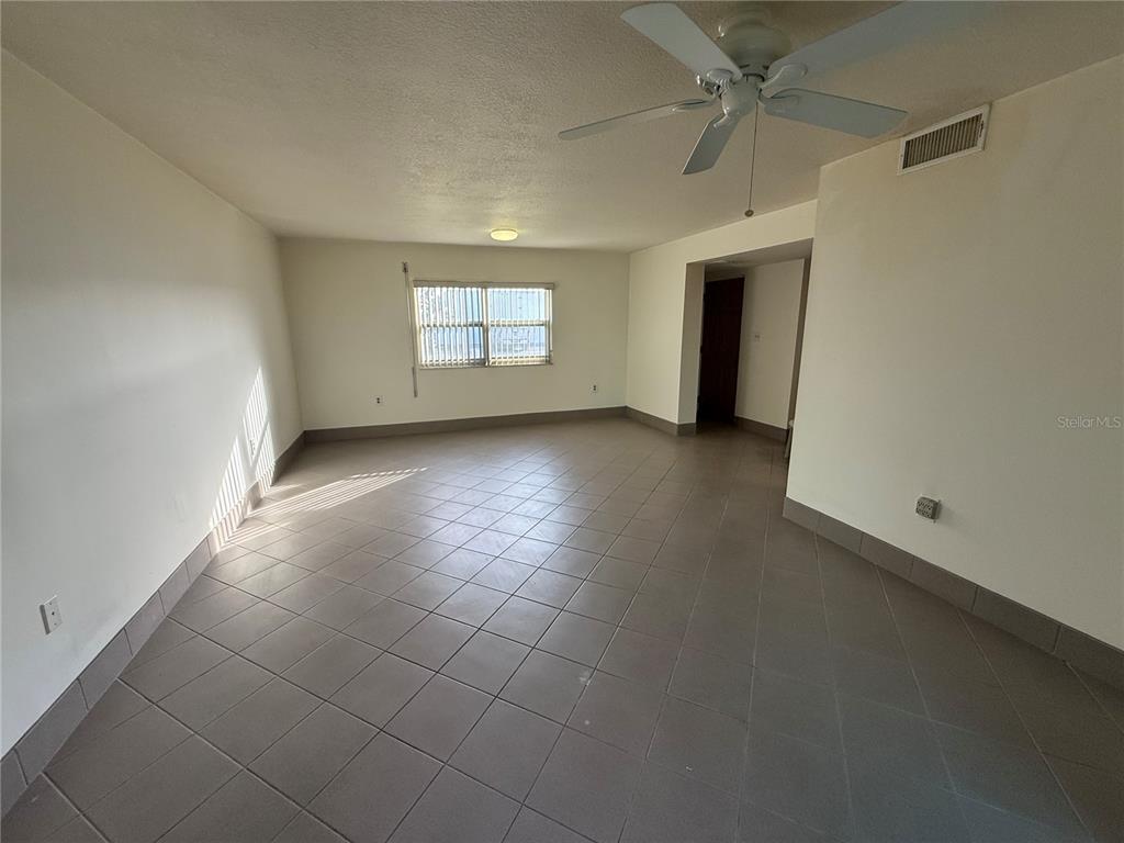 7701 Starkey Road, Unit 711 Seminole, FL 33777 - Photo 5 of 21 an empty room with windows and closet