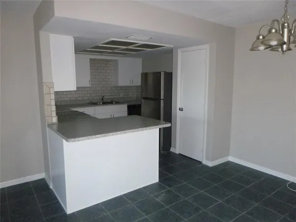 a kitchen with a sink and a stove