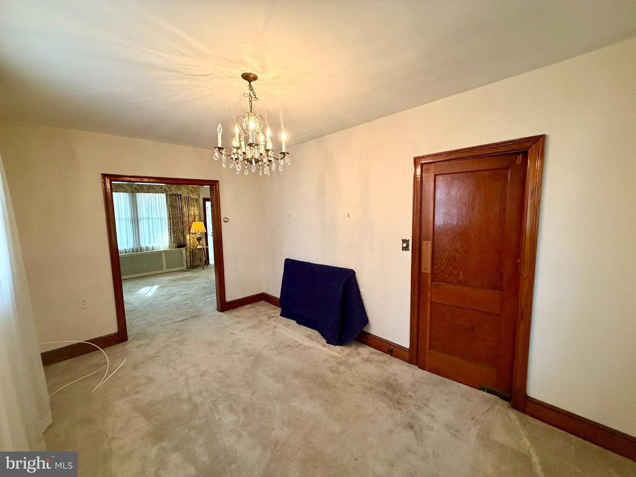 615 Powhatan Place Northwest Washington, DC 20011 - Photo 16 of 57 an empty room with chandelier and door