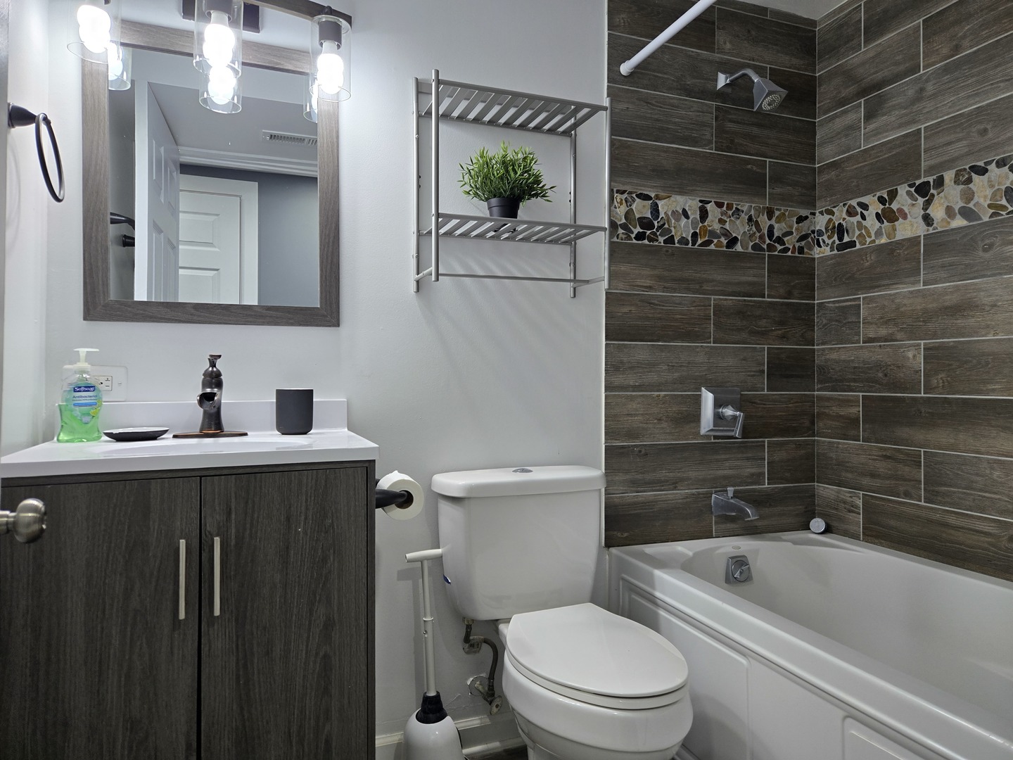 6137 South Kimbark Avenue, Unit B Chicago, IL 60637 - Photo 14 of 20 a bathroom with a sink a toilet and shower