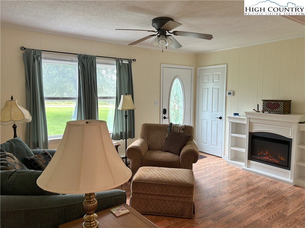4222 Ridgeglen Road Sparta, NC 28675 - Photo 3 of 31 a living room with furniture and a fireplace