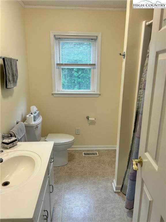 4222 Ridgeglen Road Sparta, NC 28675 - Photo 8 of 31 a bathroom with a sink and a toilet