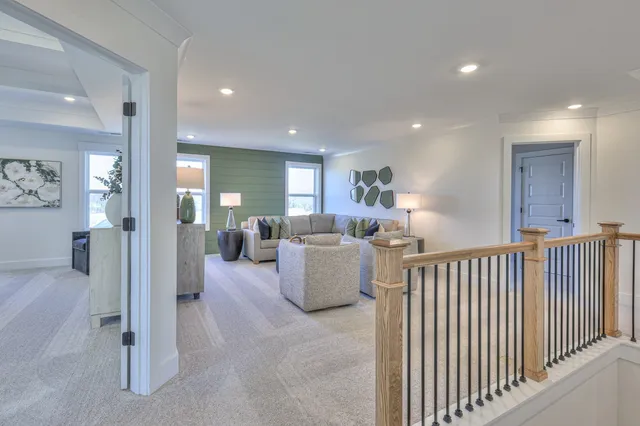 a bedroom with a bed and ceiling fan