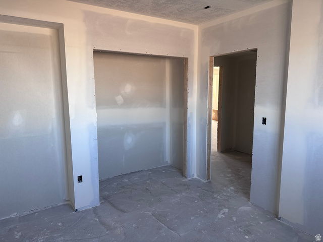 5777 West 4100 South Hooper, UT 84315 - Photo 36 of 41 Unfurnished bedroom featuring a closet