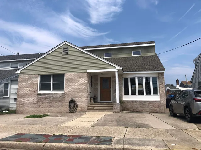 a front view of a house with parking space